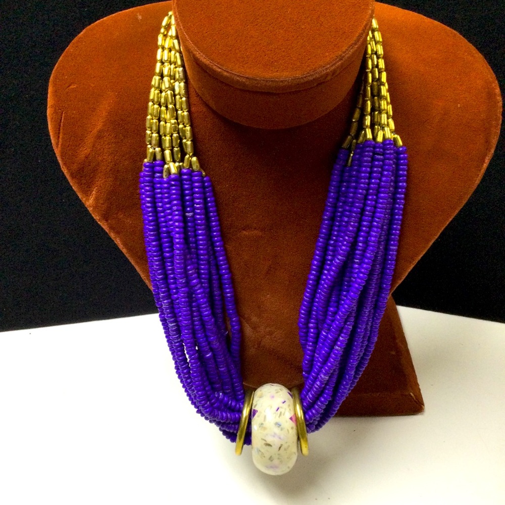 Multi strand beaded necklace with pendant